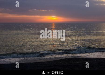 Sunset over the Irish Sea as seen from the beach at Aberystwyth in Wales. Stock Photo