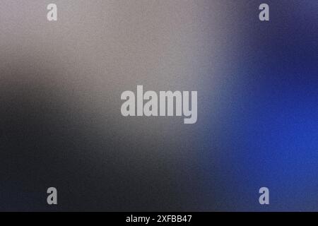 Abstract blurred gradient background blending blue and grey tones with a grainy texture Stock Photo