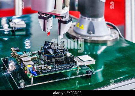 Technological process of internal assembly of chip components on PCB boards at the industry Stock Photo