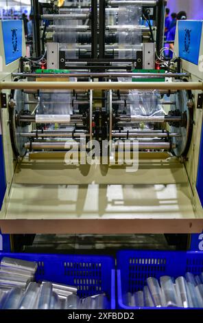 The operation of automatic plastic bag production machine for packaging Stock Photo