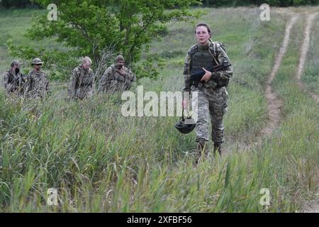 June 29, 2024, Zaporizhzhia, Ukraine: A Ukrainian servicewoman military medic Anastasia, 29years old (right), of 141st Separate Infantry brigade seen during the military practice. Ukraine and Russia are facing a ''deadly summer'' during which both sides will suffer heavy losses and may not be able to achieve a decisive turning point. For Ukraine, the task now will be to hold its frontline positions with fresh Western weapons. In turn, Russia will continue to use its usual tactics: meat assaults for small successes. (Credit Image: © Andriy Andriyenko/SOPA Images via ZUMA Press Wire) EDITORIAL U Stock Photo