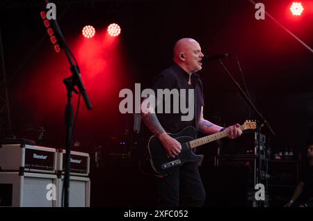 Guildford / UK - Jun 29 2024: Baz Warne sings and plays guitar with The Stranglers at Guilfest music festival, Guildford, Surrey, UK. Stock Photo