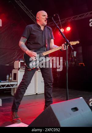 Guildford / UK - Jun 29 2024: Baz Warne sings and plays guitar with The Stranglers at Guilfest music festival, Guildford, Surrey, UK. Stock Photo