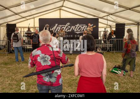 Guildford / UK - Jun 29 2024: A band called The Zone plays to a sparse audience on day one of Guilfest music festival, Guildford, Surrey, UK. Stock Photo