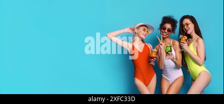 Three Women in Swimsuits Enjoying Cocktails on a Summer Day Stock Photo