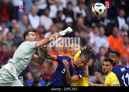 Munich, Germany. 02nd July, 2024. Romania's goalkeeper Florin Nita fight for the ball with Nathan Ake of the Netherlands during the Euro 2024 soccer match between Romania and Netherlands at the Munich Football Arena, Munich, Germany - Tuesday July 2, 2024. Sport - Soccer . (Photo by Spada/LaPresse) Credit: LaPresse/Alamy Live News Stock Photo