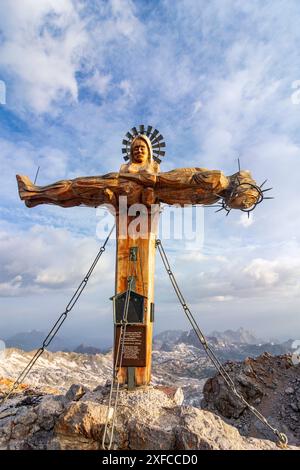 summit Schönfeldspitze in mountain range Steinernes Meer, summit cross showing Virgin Mary cradling the dead body of Jesus a wooden PietÃ  Steinernes Stock Photo