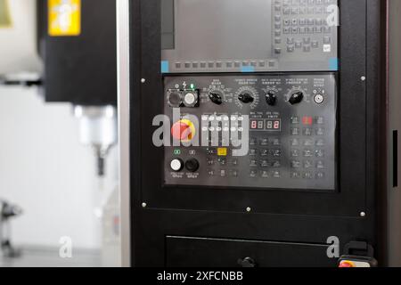 Vertical CNC milling machine with control panel. Selective focus. Stock Photo