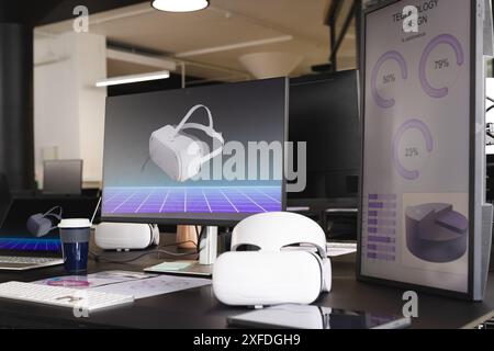 Using VR headsets, office workers developing technology design on computer screens Stock Photo