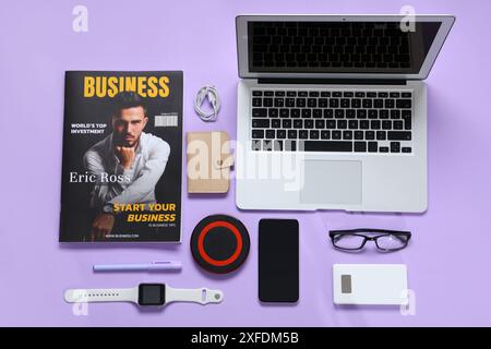 Composition with modern gadgets, accessories and magazine on lilac background Stock Photo