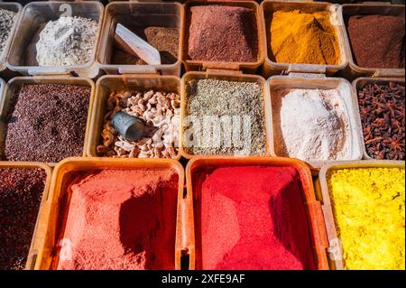 assortment of various oriental spices on the counter at the uzbek bazaar in Uzbekistan Stock Photo