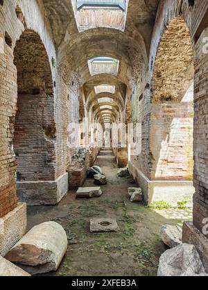 Built even before the Colosseum and probably a model for it, the amphitheatre of Capua is one the best preserved amphitheatre of the Roman times Stock Photo