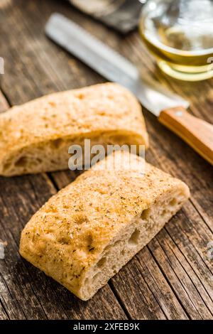 Italian ciabatta bread on a wooden table. Stock Photo