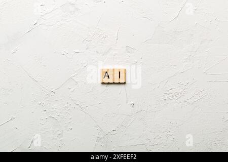 Artificial Intelligence word written on wood block. AI text on cement table for your desing, concept. Stock Photo