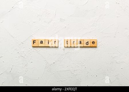 fair trade word written on wood block. fair trade text on cement table for your desing, concept. Stock Photo