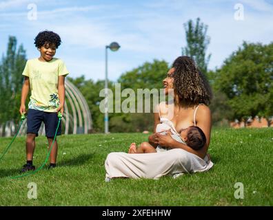 Nude mother breastfeeding infant son Stock Photo - Alamy