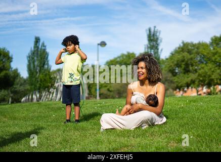 Nude mother breastfeeding infant son Stock Photo - Alamy