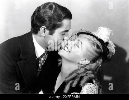 TYRONE POWER and ALICE FAYE publicity portrait for IN OLD CHICAGO 1938 director HENRY KING story Niven Busch screenplay Lamar Trotti and Sonja Levien Twentieth Century Fox Stock Photo