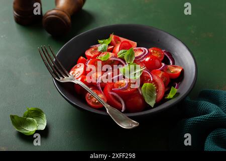 healthy tomato salad with onion basil olive oil and balsamic vinegar Stock Photo