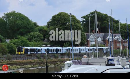 Lymington Harbour, England. 18 June 2024. A South Western Railway train travelling from Lymington Pier to the Lymington Town station. Stock Photo