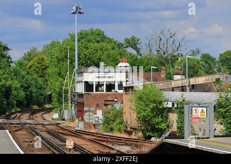 Brockenhurst Station, England. 18 June 2024. The signal box and tracks just outside Brockenhurst station. Stock Photo