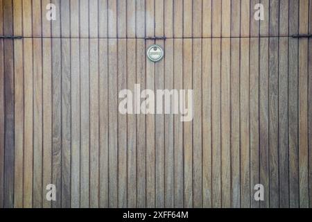 There is a small copper insert on a wooden background. Wood texture, abstract wooden background. Stock Photo