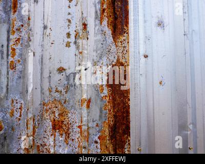 Corroded metal background. The metal walls have rust spots. Rusted metal background with rust marks, rust stains. Rystycorrosion Stock Photo