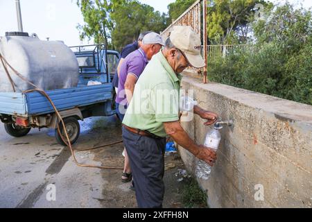 Sicily - San Miceli Aqueduct. Sicily. Province of Trapani. People forced to fill water due to the lack of daily water which leads to water rationing by the aqueducts due to the severe drought in Sicily Editorial Usage Only Stock Photo