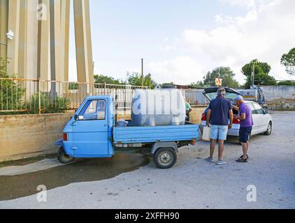 Sicily - San Miceli Aqueduct. Sicily. Province of Trapani. People forced to fill water due to the lack of daily water which leads to water rationing by the aqueducts due to the severe drought in Sicily Editorial Usage Only Stock Photo