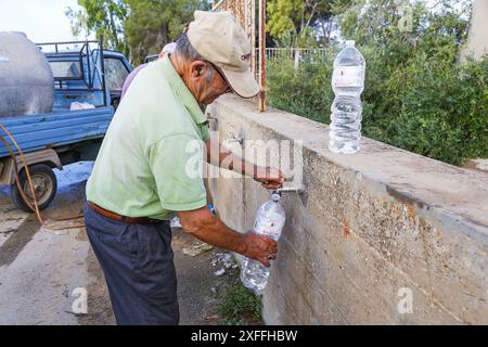 Sicily - San Miceli Aqueduct. Sicily. Province of Trapani. People forced to fill water due to the lack of daily water which leads to water rationing by the aqueducts due to the severe drought in Sicily Editorial Usage Only Stock Photo