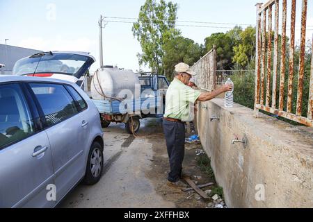 Sicily - San Miceli Aqueduct. Province of Trapani. People forced to fill water due to the lack of daily water which leads to water rationing by the aqueducts due to the severe drought in Sicily Editorial Usage Only Stock Photo