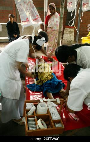 ICDDR, B authority gives treatment to a patient at ICDDR,B Hospital. August 26, 2007 Stock Photo