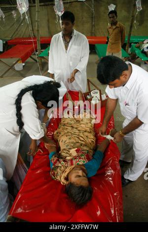 ICDDR, B authority gives treatment to a patient at ICDDR,B Hospital. August 26, 2007 Stock Photo