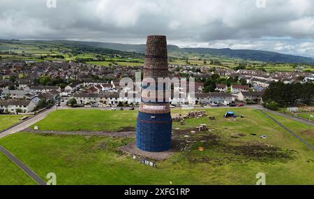 Craigyhill bonfire in Larne, Co. Antrim which is estimated to be 200 feet or 60 meters tall. Picture date: Wednesday July 3, 2024. The burning of loyalist bonfires is part of the traditional Twelfth commemorations marking the anniversary of the Protestant King William's victory over the Catholic King James at the Battle of the Boyne in 1690. Stock Photo