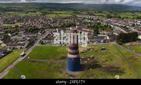 Craigyhill bonfire in Larne, Co. Antrim which is estimated to be 200 feet or 60 meters tall. Picture date: Wednesday July 3, 2024. The burning of loyalist bonfires is part of the traditional Twelfth commemorations marking the anniversary of the Protestant King William's victory over the Catholic King James at the Battle of the Boyne in 1690. Stock Photo