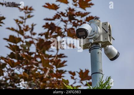 Camera hanging on the wall for video surveillance Stock Photo