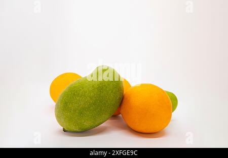 Mixed Fruits Isolated White Background Tropical Mangoes and Oranges Tangerine Cut Slices in Basket Stock Photo