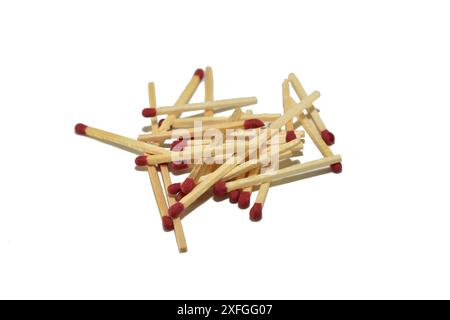 Ordinary wooden matches with a sulfur head lie on white. Stock Photo