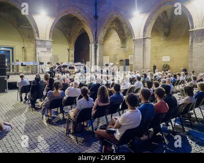 Cremona, Italy - June 28th 2024 Cremona Summer Festival Ensemble Miyaji, Large group of people attending a classical music concert outdoors at night, Stock Photo