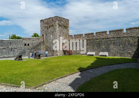 Cahir castle sits on a small rocky island in the middle of the River Suir. The name derives from the Irish word cathair - a stone fort. Stock Photo