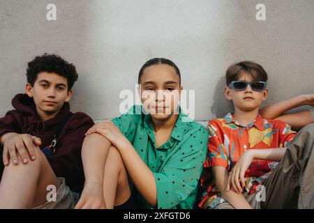 Portrait of a group, three boys and a girl Stock Photo - Alamy