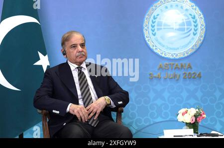 Astana, Kazakhstan. 03rd July, 2024. Pakistani Prime Minister Shehbaz Sharif, listens to Russian President Vladimir Putin, before the start of a bilateral meeting on the sidelines of the Shanghai Cooperation Organization Summit, July 3, 2024, in Astana, Kazakhstan. Credit: Gavriil Grigorov/Kremlin Pool/Alamy Live News Stock Photo