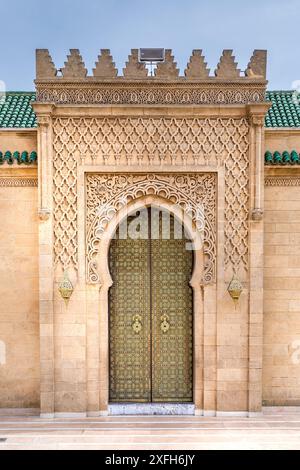 Fez, Morocco - March 23, 2024: Brass gate and zellige mosaic tilework on Dar al-Makhzen or Dar el-Makhzen royal palace in Fez, Morocco Stock Photo
