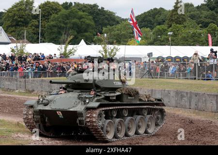 An American army World War Two M24 Chaffee light tank driving around the arena at Bovington Tank Museum during Tankfest 2024 Stock Photo