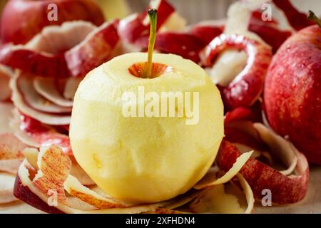 Preparing apple for a pie.  Peeling gala apples. Stock Photo