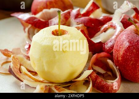 Preparing apple for a pie.  Peeling gala apples. Stock Photo