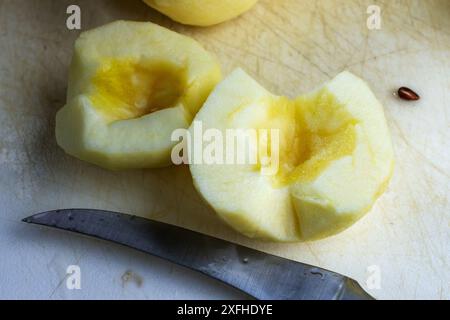 Gala apple cut in half with the core and seeds removed.  Preparation for a pie. Stock Photo