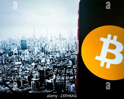 New York, New York, USA. 1st July, 2024. Bitcoin, introduced in 2009 by an anonymous entity known as Satoshi Nakamoto, is the first and most well-known cryptocurrency. It operates on a decentralized ledger called blockchain, which ensures transparent and secure transactions. Bitcoin is often referred to as digital gold due to its finite supply of 21 million coins. It has become a popular investment and a hedge against traditional financial systems, influencing the development of countless other cryptocurrencies. (Credit Image: © Taidgh Barron/ZUMA Press Wire) EDITORIAL USAGE Stock Photo