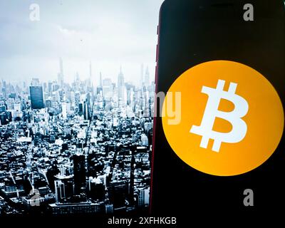 New York, New York, USA. 1st July, 2024. Bitcoin, introduced in 2009 by an anonymous entity known as Satoshi Nakamoto, is the first and most well-known cryptocurrency. It operates on a decentralized ledger called blockchain, which ensures transparent and secure transactions. Bitcoin is often referred to as digital gold due to its finite supply of 21 million coins. It has become a popular investment and a hedge against traditional financial systems, influencing the development of countless other cryptocurrencies. (Credit Image: © Taidgh Barron/ZUMA Press Wire) EDITORIAL USAGE Stock Photo