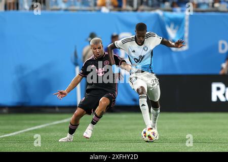 Charlotte, North Carolina, USA. 3rd July, 2024. Charlotte FC midfielder DJIBRIL DIANI (28) competes for the ball against Inter Miami defender MARCELO WEIGANDT (57) during the second half of the Charlotte FC vs Inter Miami CF MLS match at Bank of America Stadium in Charlotte, NC on July 3, 2024. (Credit Image: © Cory Knowlton/ZUMA Press Wire) EDITORIAL USAGE ONLY! Not for Commercial USAGE! Stock Photo